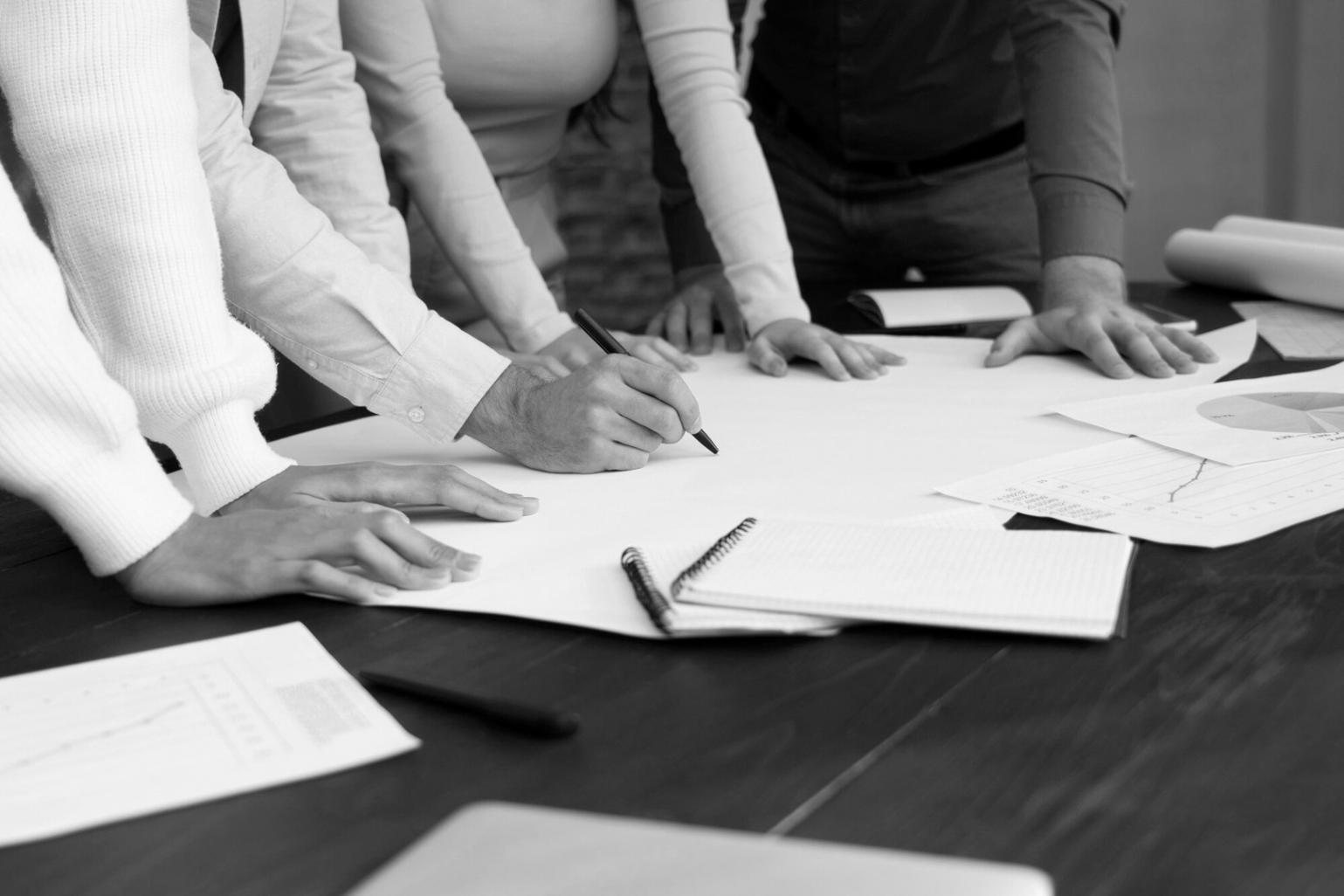 Professional workspace showing strategic planning and business communication materials