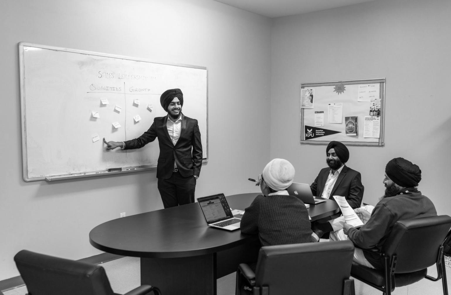 Executive team reviewing comprehensive business presentation materials