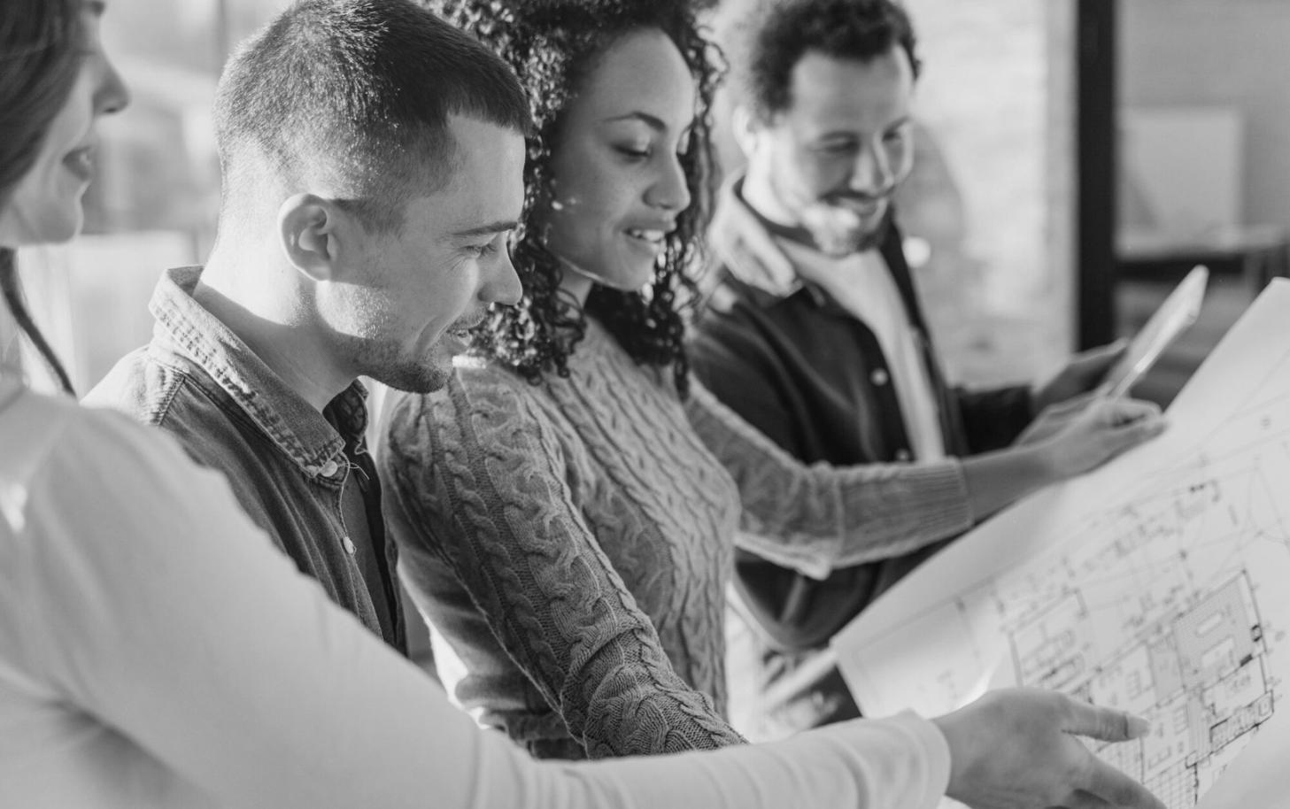 Business professional reviewing detailed client reports and data visualizations